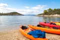 Kayaks arranged on the beach in Greece.