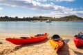 Kayaks arranged on the beach in Greece.