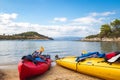 Kayaks arranged on the beach in Greece.