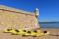 Kayaks on the beach next to the Lagos fort