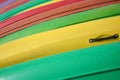 Kayaks boats stacked in a row Colorful colors