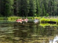 Kayaks in clear mountain stream