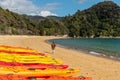 Kayaks laying at the beach of torrent bay of Abel Tasman National Park Royalty Free Stock Photo