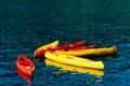 Kayaks moored in the water. Empty kayaks without people. In the Royalty Free Stock Photo