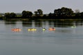 Kayaks paddling to shore on Missouri River Royalty Free Stock Photo
