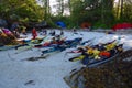 Kayaks pulled up on a shell beach after a day`s paddling