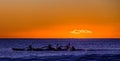 Kayaks racing at dawn Royalty Free Stock Photo