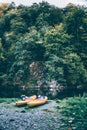 Kayaks at river bank