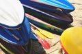 Kayaks on sand beach. Colorful boats in front of sea coast. Royalty Free Stock Photo