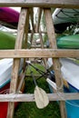 kayaks on shelves in storage. Row of colorful canoes stored on shelves Royalty Free Stock Photo