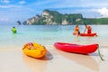 Kayaks on a tropical beach.