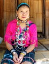 Kayan lady in bright traditional national clothes in Padaung Tribe Village of Long Neck People