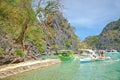 Kayangan lake limestone rock formation and boats in Coron, Palawan, Philippines