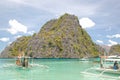 Kayangan lake limestone rock formation and boats in Coron, Palawan, Philippines