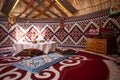 Kazak yurt interior with traditional felt carpets and furniture