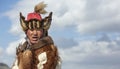 Kazakh eagle hunter traveling on hgis hotse in a landscape of altai Mountains