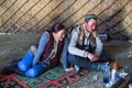 Kazakh family of hunters with golden eagles inside the mongolian Yurt.