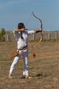 Kazakh girl shoots from a bow