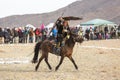 Kazakh hunter to the hare with Golden eagle - Berkutchi, in the desert foothills of Western Mongolia