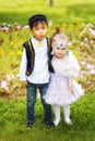 Kazakh little boy and girl together playing