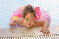 Kazakh little girl playing near swimming pool