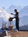 Kazakh man, in snow mountain Royalty Free Stock Photo