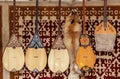 Kazakh national handmade musical instruments with horsehair strings hang on the felt wall Royalty Free Stock Photo