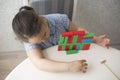 Kazakh pretty little girl playing in kids development center