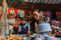 Kazakhs family of hunters with hunting golden eagles inside their the mongolian Yurts.