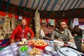 Kazakhs family of hunters with hunting golden eagles inside their the mongolian Yurts.