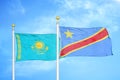 Kazakhstan and Congo Democratic Republic two flags on flagpoles and blue sky