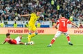 Kazakhstan national football team defender Aibol Abiken against Russia players Ilzat Akhmetov and Magomed Ozdoyev