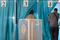 Kazakhstan, Qazaqstan, June 9, 2019, Elections, voting, A man and a woman come into a booth in the voting room. Transparent box