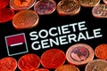 Variety of metal coins on background of Societe Generale bank logo Royalty Free Stock Photo