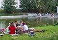 Kazan, Russia. 20.08.2021 Girls on a picnic by the city pond. Joyfull weekend