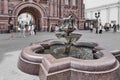 Metal, real pigeons drinking water from fountain bowls on pedestrian tourist street, Kazan, Russia