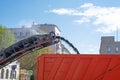 Asphalt milling machine fills dumptruck with old pavement