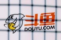 The logo of the DouYu live streaming service behind bars