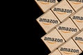 Modified photo of packages with the Amazon logo