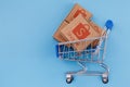 Modified photo of parcel with Shopee logo in the shopping cart on a blue background