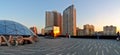 Panoramic view of the city from the observation deck on the roof of Kazan Mall and the sunset reflected in the glass elevator car.