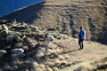 Kazbegi, Georgia, November 20, 2014: Shepherd grazing sheep in p