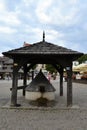 Kazimierz Dolny town square with historical wooden well, Poland