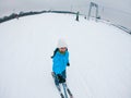 KAZKOVA POLYANA, UKRAINE - January 26, 2019: woman taking selfie while skiing down by snowed hill Royalty Free Stock Photo