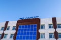 Kazpost branch with logo on it on blue sky background. Building of National postal service of Kazakhstan.