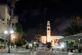 Kdumim square and St. Peter`s Church with the Clock Tower at night in old city Yafo, Israel. Royalty Free Stock Photo