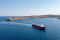 Kea, Tzia island, Cyclades, Greece. Aerial drone view of a ferry approaching Korissia port Royalty Free Stock Photo