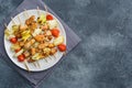 Kebab chicken, zucchini and tomatoes on skewers in a plate. Dark table Copy space Royalty Free Stock Photo