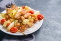 Kebab chicken, zucchini and tomatoes on skewers in a plate. Dark table Copy space Royalty Free Stock Photo