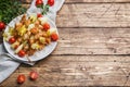 Kebab chicken, zucchini and tomatoes on skewers in a plate. Wooden table. Copy space Royalty Free Stock Photo